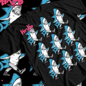 May include: Black t-shirt featuring a repeating pattern of cartoon sharks with blue fins and open mouths. The sharks are depicted with legs and are in various poses. The Japanese text "Doronhedoro" is visible in the upper left corner.