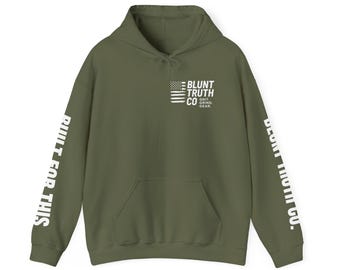 May include: Olive green hoodie with a front pocket and drawstring hood. The hoodie features the text "BLUNT TRUTH CO. GRIT. GRIND. GEAR." and an American flag design on the chest. The sleeves have the text "BUILT FOR THIS" and "BLUNT TRUTH CO."