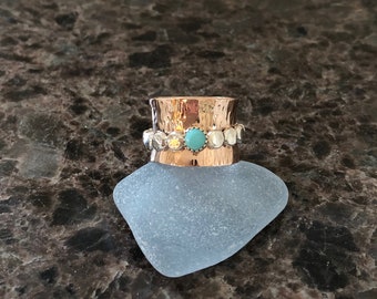 Bronze and sterling silver spinner ring with turquoise set in 14k gold