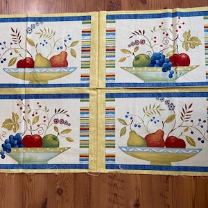 May include: Four fabric panels with a yellow background and blue and red stripes. Each panel features a white bowl filled with fruit, including pears, apples, and grapes, with green leaves and stems.