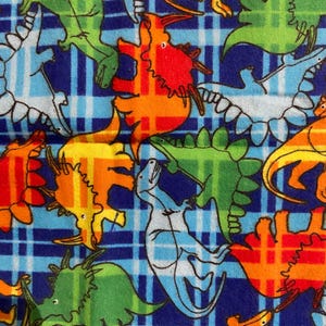 May include: A blue and white checked fabric with a colourful dinosaur pattern. The dinosaurs are in various colours, including red, orange, yellow, green, and blue. The fabric is ideal for crafting projects, such as quilts, cushions, and tote bags.
