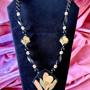 Collectible vintage ceramic necklace designed by Lee Sands, likely from the 1970s or 1980s.
