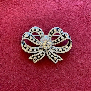 Joan Rivers Rhinestone Brooch; vintage silvertone bow.