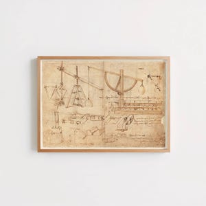 May include: A framed print featuring a sepia-toned technical drawing of mechanical engineering concepts. The illustration displays various pulleys, levers, and structural components rendered in ink on aged paper, complete with handwritten notes.
