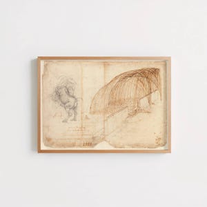 May include: Framed vintage architectural sketch featuring a horse and a building with an arched roof. The artwork is rendered in sepia tones on aged paper, encased in a light wood frame.