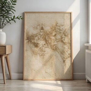May include: A framed sepia-toned sketch featuring a group of expressive faces. The artwork, with visible pencil strokes, depicts several figures in profile and full-face views, showcasing detailed facial features and expressions. The frame is a light-colored wood.