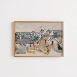 Peut inclure: Une peinture de paysage encadrée représentant un village rural avec des maisons aux toits gris et orange, un arbre dénudé au premier plan et des tons doux et sourds de vert, de brun et de gris sous un ciel pâle et couvert.