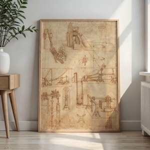May include: A framed print featuring detailed sepia-toned sketches of mechanical designs. The artwork, reminiscent of historical blueprints, is encased in a light brown wooden frame. The sketches depict various machines and mechanisms, showcasing a vintage aesthetic.