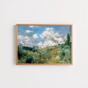 May include: A framed landscape painting featuring a vibrant blue sky filled with white and gray clouds above a rolling green hillside. The artwork displays textured brushstrokes depicting dense foliage, grassy slopes, and a tall tree on the right.
