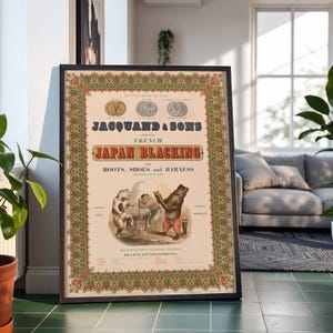 May include: A framed vintage advertisement poster for Jacquand & Sons French Japan Blacking for boots, shoes, and harness. The cream-colored print features a decorative green and red border, three circular coin illustrations, and bears.