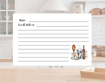 Puede incluir: Una tarjeta de receta blanca con espacios con líneas para escribir. La tarjeta tiene el texto "Recipe:" y "From the kitchen of:" en la parte superior. Una ilustración de acuarela de utensilios de cocina, incluyendo una batidora, cuchara y rodillo, decora la parte inferior.