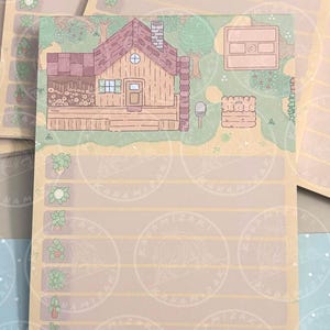 May include: A stack of beige notepads with a cartoon illustration of a cabin, garden, and crops. The notepad has horizontal lines for writing and a series of crop icons along the left side. The background has a repeating pattern of a circular logo.