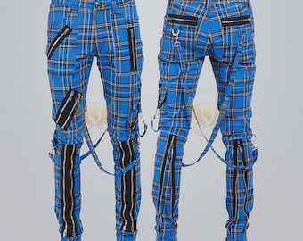 May include: Blue plaid pants with black zippers and suspenders. The pants feature a classic plaid pattern in blue, yellow, and black. Multiple black zippers are placed on the front and sides. Suspenders are attached to the waistband.