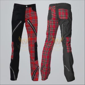 May include: Black and red tartan trousers with zip detailing. One leg is solid black, the other is red tartan. The trousers feature multiple zips and pockets. The style is punk rock.