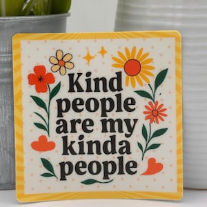 May include: Square sticker with a yellow border and the text "Kind people are my kinda people" in black. The sticker features orange and yellow flowers, green leaves, and orange hearts on a dotted background.