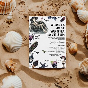 May include: A Halloween-themed invitation card with the text "Ghouls Just Wanna Have Sun" and illustrations of a skeleton in a pool float, cocktails, and bats. The card is surrounded by seashells on a sandy background.