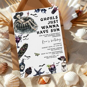 May include: A Halloween-themed birthday party invitation with the text "Ghouls Just Wanna Have Sun." The invitation features illustrations of a skeleton, bats, cocktails, and other spooky elements. The invitation is on a sandy background with seashells.