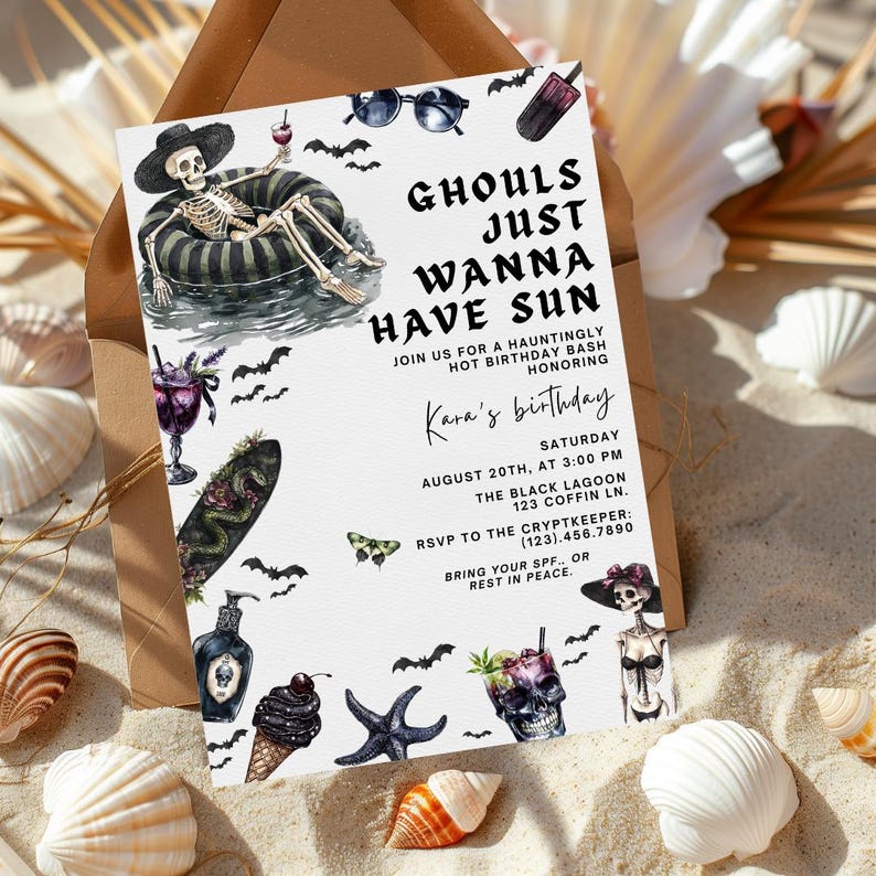 May include: A Halloween-themed birthday party invitation with the text "Ghouls Just Wanna Have Sun." The invitation features illustrations of a skeleton, bats, cocktails, and other spooky elements. The invitation is on a sandy background with seashells.