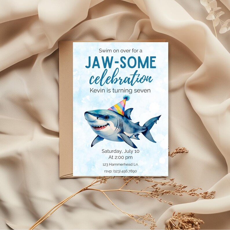 May include: A birthday party invitation with a watercolor illustration of a smiling shark wearing a party hat. The invitation reads "Swim on over for a JAW-SOME celebration" and includes event details.