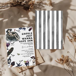May include: A Halloween-themed invitation with the text "Ghouls Just Wanna Have Sun" and illustrations of skeletons, bats, and cocktails. The invitation is on a beige background with a matching striped card.