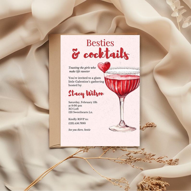 以下が含まれることがあります： 「Besties & cocktails」の文字とカクテルの水彩イラストが描かれたピンク色の招待状。 Stacy Wilsonが主催するGalentine'sの集まりへの招待状です。 日時とRSVP情報が記載されています。