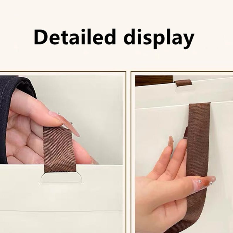 May include: A white paper gift bag featuring brown fabric ribbon handles. The image includes the text Detailed display at the top, showing a close-up view of the brown ribbon handle attached to the white paper surface of the bag.