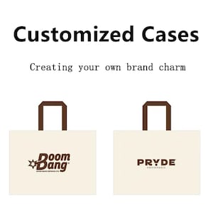 May include: Two off-white rectangular tote bags with brown handles. The left bag features a brown logo reading "Boom Bang" with a star icon and "BOOM BANG DEFENSE LTD." text. The right bag displays the brown text "PRYDE PERFORMANCE".