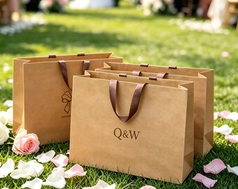 Customized logo kraft paper wedding favor bags, personalized name satin handle gift bags, perfect as a unique gift for your wedding guest.