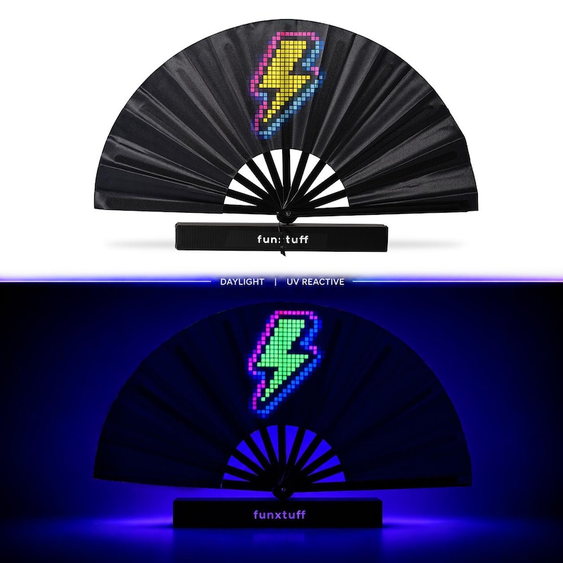 May include: A black folding hand fan featuring a pixelated yellow and blue lightning bolt graphic. The base of the fan is marked with the text fun: tuff. The fan is shown in two states: daylight and UV reactive, where the bolt glows green.