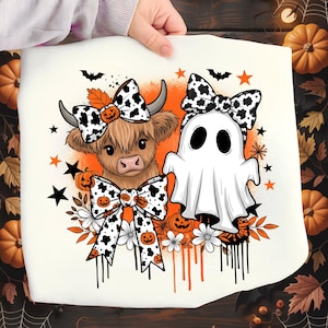 May include: A cream-colored Halloween-themed graphic featuring a Highland cow and a ghost, both adorned with cow-print bows and pumpkin accents. The design includes bats, stars, and floral elements, with an orange background.
