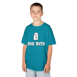 May include: A teal t-shirt featuring a white ghost graphic holding a burrito. The text "BOO-RITO" is printed in white below the ghost. The shirt is worn by a young person.