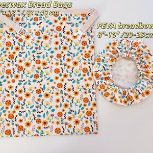 Op de afbeelding: Bijenwas broodzakken en een PEVA broodhoes. De tassen zijn wit met een bloemenpatroon in oranje, geel en teal. De broodzakken zijn 33 x 43 cm. De broodhoes is 20-25cm.