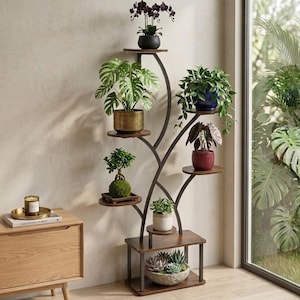 May include: A multi-tiered plant stand with a dark metal frame and wooden shelves. The stand displays various potted plants, including orchids, monstera, and succulents. The design is a mix of modern and natural elements, suitable for indoor plant decor.