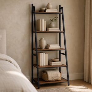 May include: A five-tier ladder bookshelf featuring a black metal frame and brown wooden shelves. The shelves are organized with various decorative items including stacks of books, ceramic vases, a small bowl, and a woven basket containing a folded textile.