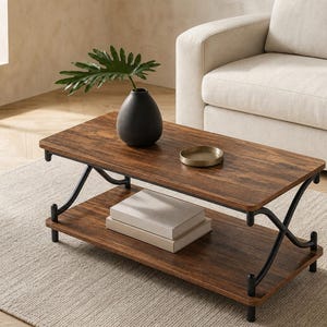 May include: A rectangular coffee table with a dark wood finish and a lower shelf. The table has black metal legs and supports. A black vase with a green plant, a small gold tray, and two books are on the table.