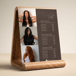 A warm neutral lifestyle product shot showing the dark brown luxury price list template displayed upright in a wooden tabletop stand on a desk surface representing how the luxury hair salon service menu looks as a premium physical display giving beauty professional, nail tech, lash tech, and esthetician an elegant in person pricing solution for their studio or salon suite