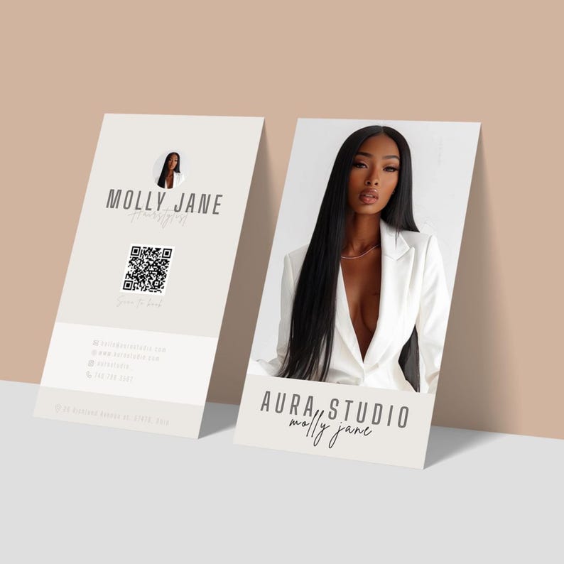 May include: Two business cards. One card features the text "MOLLY JANE HairStyling Co." with a QR code and contact information. The other card displays a woman in a white blazer with the text "AURA STUDIO molly jane".