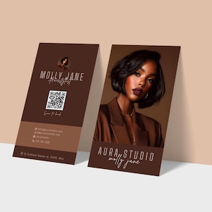 May include: Two business cards with a brown and tan color scheme. One card features the text "MOLLY JANE Hairstylist" and a QR code. The other card displays a woman in a brown blazer and the text "AURA, STUDIO molly jane".