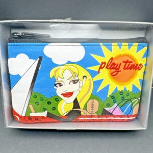 May include: A rectangular, zippered pouch with a cartoon illustration of a woman in a boat, a sun, and the words "play time." The background is blue with white clouds. The pouch is in a clear plastic box.