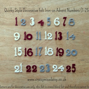 May include: Decorative felt iron-on Advent numbers 1-25 in various colors, including white, gray, and burgundy. The numbers are arranged on a wooden surface. Text at the top reads "Quirky Style Decorative Felt Iron-on Advent Numbers (1-25)".