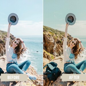 May include: A woman wearing sunglasses, a white shirt, blue top, and jeans, holding a gray hat up in the air. She is sitting on a rock with a backpack next to her. The background shows a coastal landscape with a blue sky and ocean.