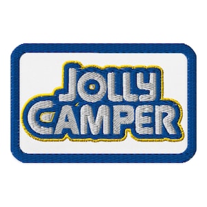 May include: Embroidered patch with the words "JOLLY CAMPER" in white, outlined in yellow, on a white background. The patch has a blue border. The design is likely for camping enthusiasts.