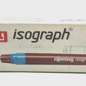 May include: A Rotring Isograph technical pen and its case are displayed on a white background. The pen is dark red with a blue section and a fine tip. The box is white with the Rotring logo and the word "isograph" in red and black.