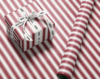 Papel de regalo a rayas rojas y blancas.