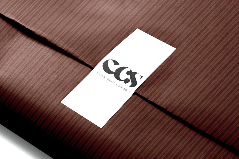 Brown striped gift wrapping paper with vertical lines, perfect for fall gifting and holiday celebrations.