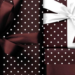 May include: Several wrapped gifts with a dark brown polka dot pattern. The gifts are adorned with dark brown and white ribbons, creating a festive and elegant presentation. The bows are large and add a touch of sophistication.
