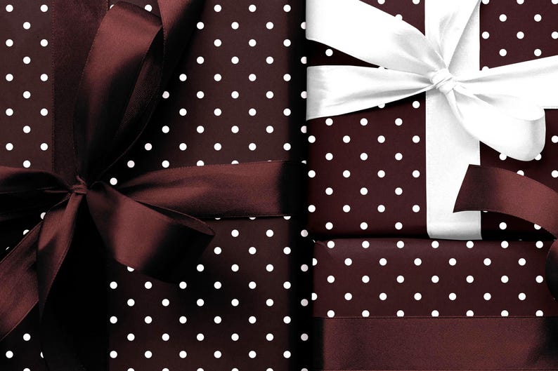 May include: Several wrapped gifts with a dark brown polka dot pattern. The gifts are adorned with dark brown and white ribbons, creating a festive and elegant presentation. The bows are large and add a touch of sophistication.