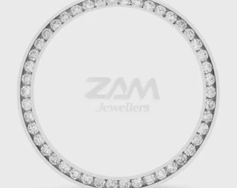 May include: A silver-coloured, circular jewellery piece with a ring of small, clear gemstones. The gemstones encircle a white background with the text "ZAM Jewellers" in grey.