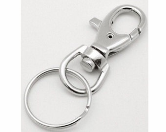 May include: Silver key chain with a swivel clasp and a round ring.