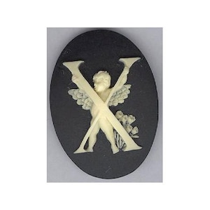 May include: A black oval cameo with a white cherub holding a pair of crossed sticks, forming the letter X. The cherub has wings and is surrounded by white flowers.